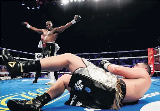  ?? PHOTO: REUTERS ?? Down and perhaps out . . . New Zealander Joseph Parker sprawls on the ground after being knocked down by British boxer Dillian Whyte during their heavyweigh­t fight at the O2 Arena in London last Sunday.