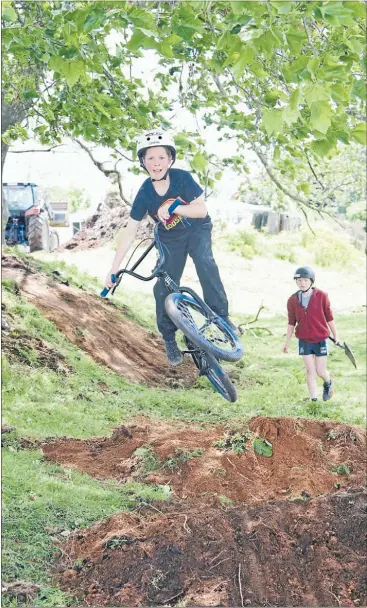  ?? Photo: ANNA KURTH ?? COOL SCHOOL: Walton School student Brodie Connolly, 11, enjoys the BMX track he and other students, including Ethan Gibbs, 11, also pictured, created at school.