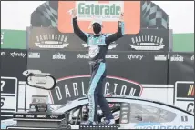  ??  ?? Kevin Harvick celebrates after winning the NASCAR Cup Series auto race
on May 17, in Darlington, South Carolina. (AP)