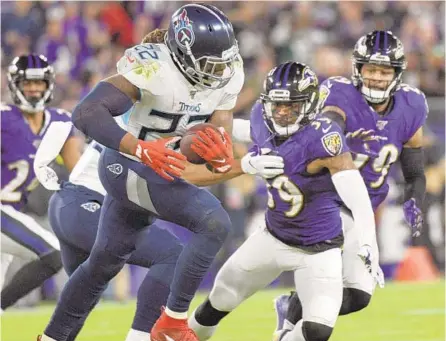  ?? JERRY JACKSON/BALTIMORE SUN ?? Tennessee Titans’ Derrick Henry carries for a 27-yard gain against the Ravens in the 2nd quarter.
