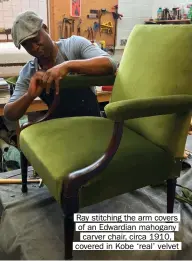  ??  ?? Ray stitching the arm covers of an Edwardian mahogany carver chair, circa 1910, covered in Kobe ‘real’ velvet