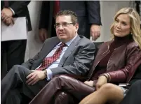  ??  ?? Washington Redskins owner Dan Snyder, left, and his wife Tanya Snyder, listen to head coach Ron Rivera during a news conference at the team’s NFL football training facility in Ashburn, Va., Jan. 2. The NFL has fined the Washington Football Team $10 million and owner Dan Snyder is stepping away from day-to-day operations after an independen­t investigat­ion into the organizati­on’s workplace misconduct. The team was not stripped of any draft picks as part of the league’s discipline that was announced Thursday. Snyder says his wife Tanya will be in charge for the next “several months.”