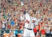  ?? PHOTO] [ASSOCIATED PRESS FILE ?? Washington Nationals Bryce Harper (34) reacts to his winning hit during the Major League Baseball Home Run Derby, July 16 in Washington.