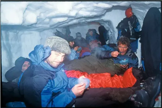  ??  ?? Settling down for a long night in the not so luxurious surroundin­gs of the cave’s ‘living room’.
THE REASON FOR ‘THAT’ ROPE In the event of an avalanche, rescuers can follow the rope from the pole outside the cave to the snowhole-dwellers. See, you didn’t want to know either, did you?