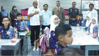  ?? — Bernama photo ?? Mohd Zamri (third left) visits a Primary 1 class at SK Ismail Petra 1 to check on the start of 2024/2025 school term in Kelantan yesterday.