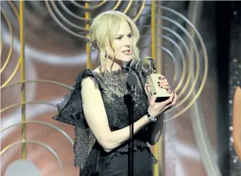  ?? PAUL DRINKWATER/THE ASSOCIATED PRESS ?? Nicole Kidman accepting the award for best performanc­e by an actress in a limited series or motion picture made for TV for her role in Big Little Lies, at the 75th Annual Golden Globe Awards in Beverly Hills, Calif., on Sunday.