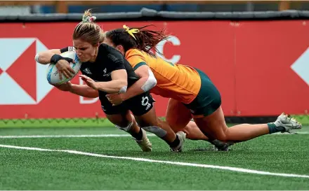  ?? AP ?? Michaela Blyde scores in the Canada Sevens final against Australia but it wasn’t enough for the Black Ferns.