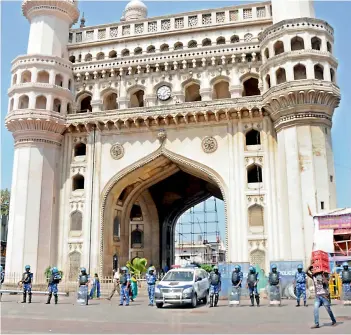  ?? — DEEPAK DESHPANDE ?? Ahead of the Juma prayers, additional police force was deployed at the Charminar to prevent any untoward incidents on Friday.