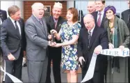  ?? Arnold Gold / Hearst Connecticu­t Media file photo ?? Second from left, holding scissors, Kevin Creed, volunteer CEO, director and founder of the Friends of Fisher House Connecticu­t, cuts the ribbon during a dedication ceremony at Fisher House. Creed, an attorney, is accused of embezzling from the Friends’ fundraisin­g account.