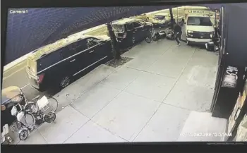  ?? JORGE ALDAZ VIA AP ?? In this photo taken from security video, a man jumps out of the way as a U-Haul truck drives onto the sidewalk, on Monday in the Brooklyn borough of New York.