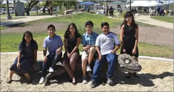  ??  ?? Oakley students enjoy a rest on the gecko bench prior to official opening of the park.