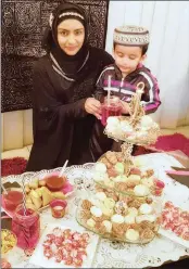  ??  ?? Getting ready for Eid is Rizwana Rasool and her son , Mohamed Faizaan.