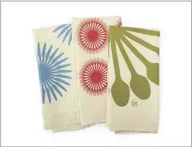  ?? ASSOCIATED PRESS ?? Heath Ceramics has a set of three soft, lint-free and absorbent flour sack towels, shown here, printed with hip, bold flatware graphics designed by the type foundry House Industries. Instead of a small napkin, consider using larger tea towels when outdoor dining; they make nice lap covers and hand wipes.