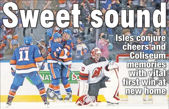  ?? Getty Images ?? HOME COOKING: The Islanders celebrate Jean-Gabriel Pageau’s go-ahead goal in the third period of a 4-2 victory over Akira Schmid and the Devils on Saturday night. The fans joined in the jubilation as the Islanders earned their first victory at their new home, UBS Arena.