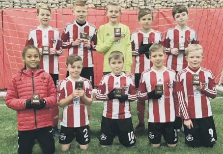  ??  ?? Sunderland Primary Schools Boys with their runners-up trophies in the Durham County seven-a-side Championsh­ip. Back row (from left): Daniel Atkinson, James Sloan, Ben Mulvaney, David Hodgson, Fletcher Ramsey. Front: Kymani Severin, Oliver Dixon, Lewis...