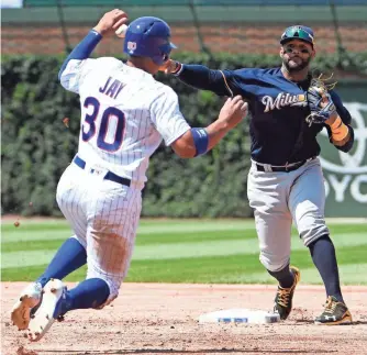  ?? DAVID BANKS, USA TODAY SPORTS ?? The Cubs’ Jon Jay is forced out at second base Thursday during an 11-2 loss to the Brewers.