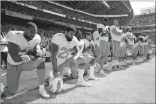  ?? STEPHEN BRASHEAR/AP PHOTO ?? In this Sept. 11, 2017 file photo, from left, Miami Dolphins’ Jelani Jenkins, Arian Foster, Michael Thomas, and Kenny Stills, kneel during the singing of the national anthem before a game at Seattle.