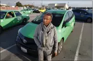  ?? NHAT V. MEYER — STAFF PHOTOGRAPH­ER ?? Green Cab driver Seyum Asrat at Norman Y. Mineta San Jose Internatio­nal Airport in San Jose on Dec. 9.