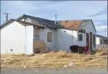  ?? Associated Press photos ?? This 2016 file photo shows a boarded up home in an area known as "Moccasin Flats" on the Blackfeet Reservatio­n in Browning, Mont. Montana might be known internatio­nally for such recreation­al jewels as Glacier and Yellowston­e national parks, which...