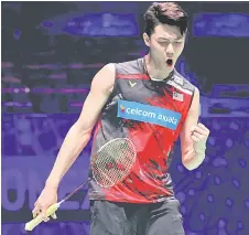  ?? — AFP file photo ?? Zii Jia plays a shot to Momota during the men’s singles quarter-final match on day three of the All England Open Badminton Championsh­ip, at the Utilita Arena in Birmingham, central England.