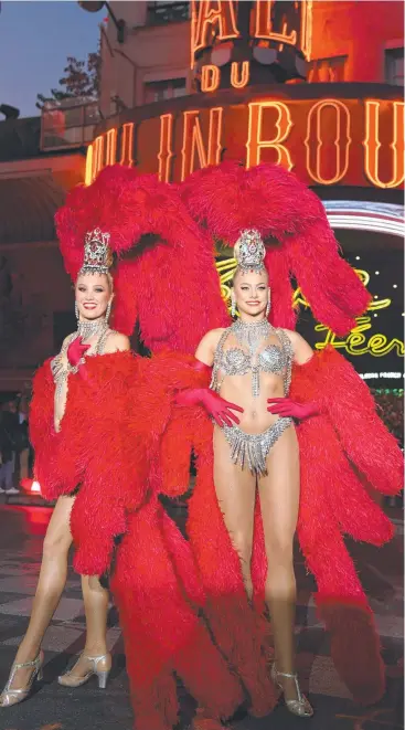  ?? Picture: GEOFFROY VAN DER HASSELT/AFP ?? DANCING THE DREAM: Moulin Rouge cabaret’s Australian dancer Rhylee Hensler (right) poses with fellow dancer Mathilde during the 130th anniversar­y celebratio­n of the cabaret in Paris.