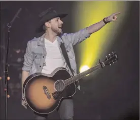  ?? The Canadian Press ?? Brett Kissel performs during the Country Thunder Humboldt Broncos tribute concert in Saskatoon, Friday.