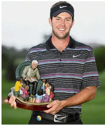  ??  ?? Title drought: Scotland’s Scott Jamieson holds the trophy after winning the inaugural Nelson Mandela Championsh­ip Golf tournament in Durban, South Africa, on Dec 9, 2012. He’s seeking his first win in six years at the ongoing Alfred Dunhill Championsh­ip. — AP