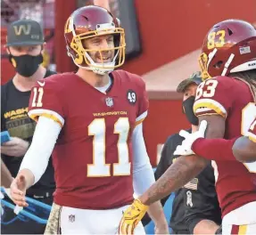  ?? GEOFF BURKE/USA TODAY SPORTS ?? Washington QB Alex Smith has made a remarkable recovery from a lifethreat­ening injury.