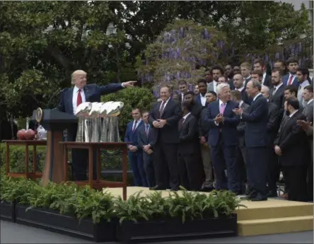  ?? SUSANWALSH — THE ASSOCIATED PRESS ?? President Donald Trump speaks on the South Lawn of the White House in Washington on Wednesday during a ceremony where he honored the Super Bowl Champion New England Patriots for their Super Bowl LI victory.