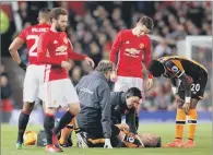  ?? PICTURE: MARTIN RICKETT/PA ?? FLOORED: Hull City’s Markus Henriksen had to be helped off after a challenge with Manchester United’s Paul Pogba.