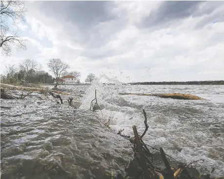  ?? DAN JANISSE ?? Waves hit the shore at the St. Rose Beach in the Riverside area Thursday as high waters continue to raise flood concerns. Windsor Mayor Drew Dilkens is pushing local MPS and MPPS to lobby for major infrastruc­ture funding to kick-start the economy and mitigate future flooding.