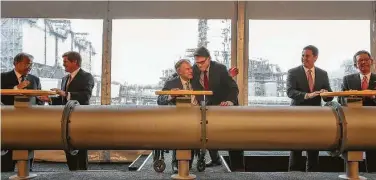  ?? Steve Gonzales / Staff file photo ?? Gov. Greg Abbott and then-Energy Secretary Rick Perry embrace after a ceremony for a carbon capture plant’s opening in 2017. Fossil fuel companies know they need carbon capture to survive in the long term.