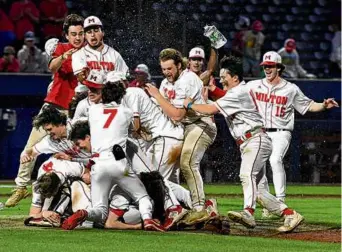  ?? MARK STOCKWELL FOR THE GLOBE ?? For the second year in a row, the Milton High baseball team culminated its season with a happy dogpile on the mound.