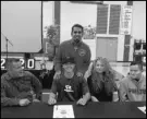  ?? Photo courtesy of Paraclete ?? PIRATE — Paraclete baseball player Ethan Rosario, second from left, poses with, from left to right, his dad Alex, mom Sandra and brother Eddie, with Paraclete coach Greg Burnias, back, after signing to play at Whitworth.