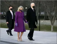  ?? ALEX BRANDON — THE ASSOCIATED PRESS ?? President-elect Joe Biden and his wife Jill arrive for a COVID-19 memorial, with lights placed around the Lincoln Memorial Reflecting Pool, Tuesday, Jan. 19, 2021, in Washington.