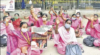  ?? PTI ?? ASHA workers, mid-day meal workers and Anganwadi workers protest against the state government in Bengaluru.