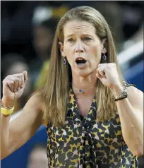  ?? ASSOCIATED PRESS FILE PHOTO ?? Michigan head coach Kim Barnes Arico directs her team against Michigan State last season. The outbreak of the coronaviru­s has completely changed how college coaches are recruiting.