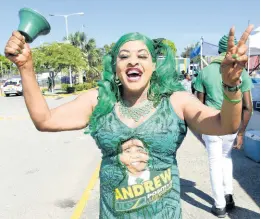  ?? IAN ALLEN/ PHOTOGRAPH­ER ?? Patricia Webb, the self-proclaimed “movie star from Westmorela­nd”, rings the JLP bell on the Independen­ce Park complex Sunday.