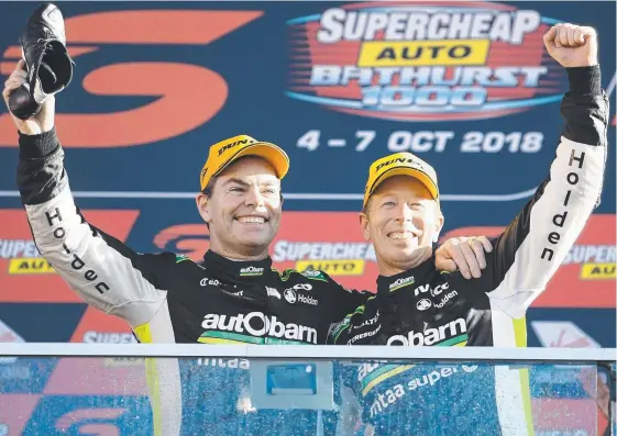  ?? Picture: GETTY IMAGES ?? Craig Lowndes and Steve Richards are on top of the mountain after their Bathurst 1000 win.