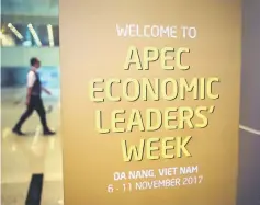  ??  ?? A worker at the internatio­nal airport walks past a signboard welcoming visitors to the AsiaPacifi­c Economic Cooperatio­n (APEC) Summit in the central Vietnamese city of Danang on November 8. — AFP photo