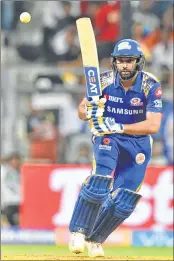  ??  ?? Mumbai Indians Rohit Sharma plays a shot against Royal Challenger­s Bangalore at the Wankhede stadium in Mumbai on Tuesday night.