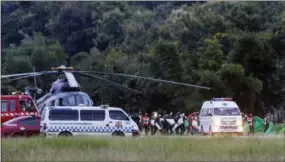  ?? THE ASSOCIATED PRESS ?? An ambulance believed to be carrying one of the rescued boys from the flooded cave heads to the hospital in Chiang Rai as divers evacuated the remaining boys and their coach trapped at Tham Luang cave in the Mae Sai district of Chiang Rai province,...