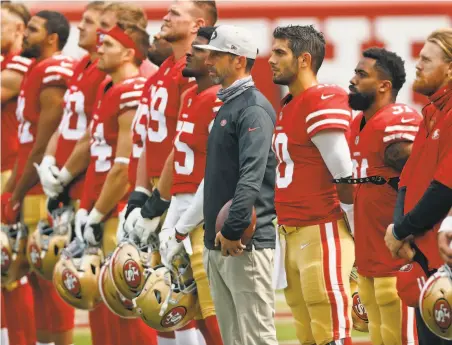  ?? Scott Strazzante / The Chronicle ?? Niners head coach Kyle Shanahan ( center) said running back Raheem Mostert ( second from right) may return against the Rams.