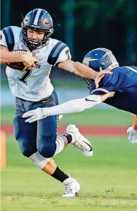  ?? [PHOTOS BY NATE BILLINGS, THE OKLAHOMAN] ?? Perkins-Tryon’s Austin Mages, left, tries to get past Heritage Hall’s Preston Nelson on Thursday night in Oklahoma City.