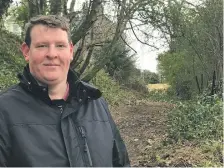  ??  ?? Gary Gemmell at the foot of the muddy path he wants to give a makeover for safe community use.