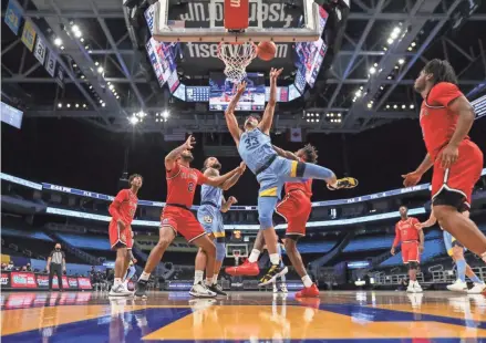  ?? MARQUETTE ATHLETICS ?? Marquette forward Dawson Garcia, who scored 20 points Sunday, finds space in the Red Storm defense for a basket.