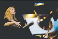  ?? Siimon, Provided by mariaschne­ider.com ?? Bandleader/composer Maria Schneider in action.