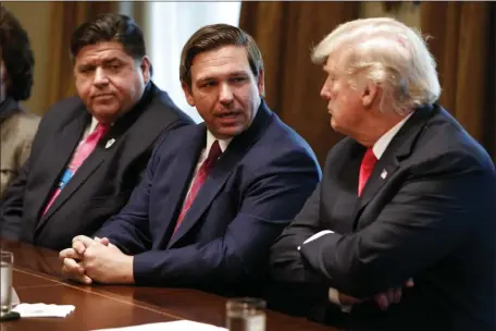  ?? EVAN VUCCI, FILE — THE ASSOCIATED PRESS ?? Governor-elect Ron DeSantis, R-Fla., talks with President Donald Trump during a meeting with newly elected governors at the White House, Dec. 13, 2018.