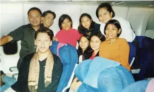  ??  ?? Filipino nurses on the flight from the Philippine­s to London on their way to work in the NHS across West Wales in April 2001.