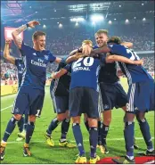  ?? AFP ?? Hamburg's players celebrate after the German first division Bundesliga football match in Cologne on Friday